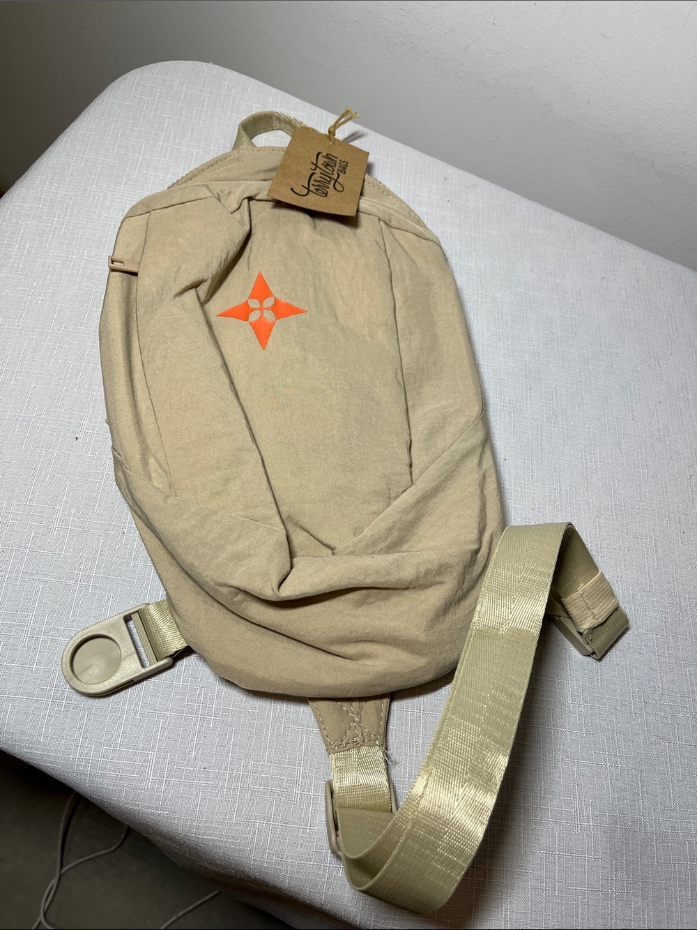 TerryTown Beige unisex Sling Bag with Orange Accent
New